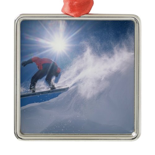 Man jumping off a large cornince on a snowboard metal ornament