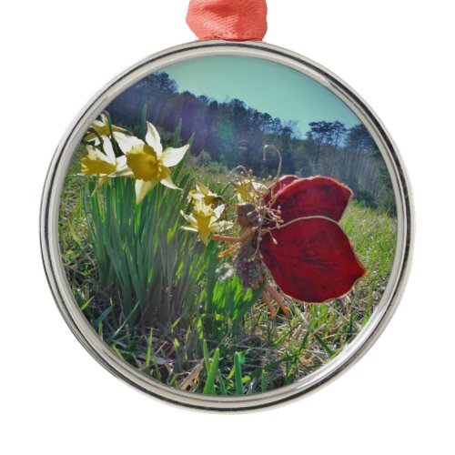 red wing fairy and daffodils metal ornament
